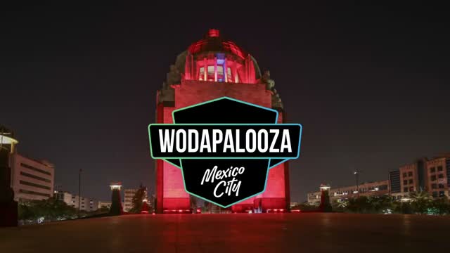 The Monumento a la Revolución lit red, the Wodapalooza mark locking over it