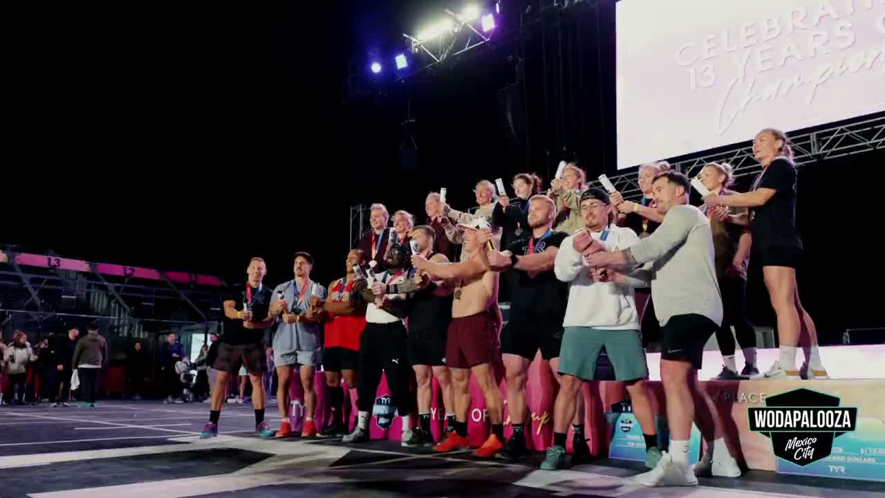 Athletes celebrating under a burst of confetti